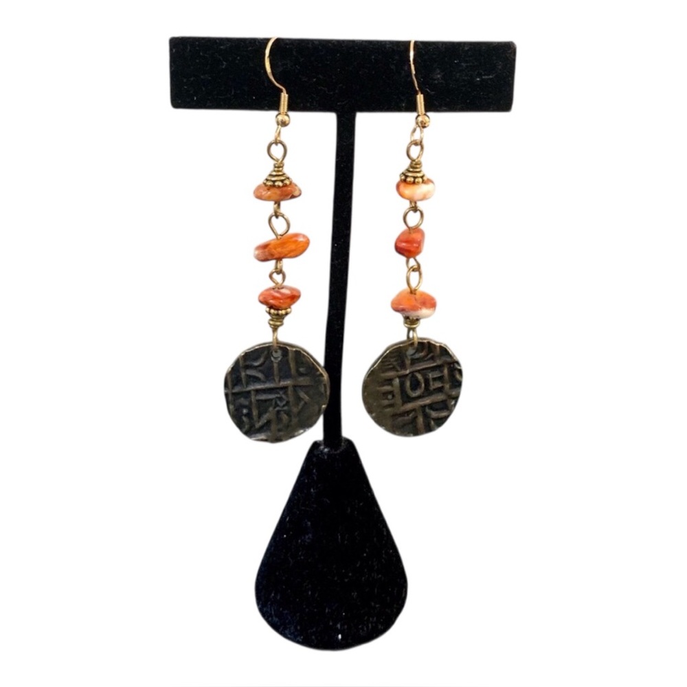Handmade artisanal earrings featuring Bhutan vintage coins and coral stones